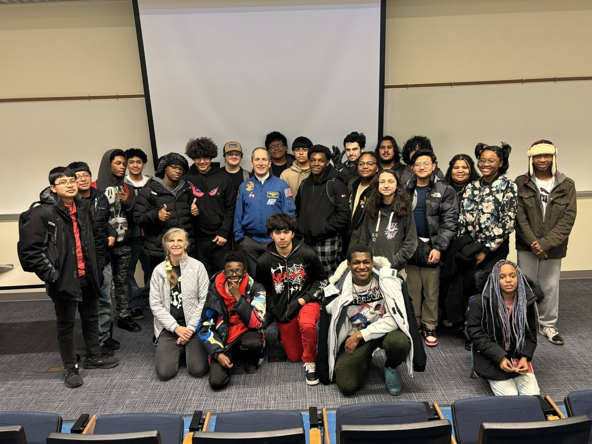 Students pose with Dr. John Herrington